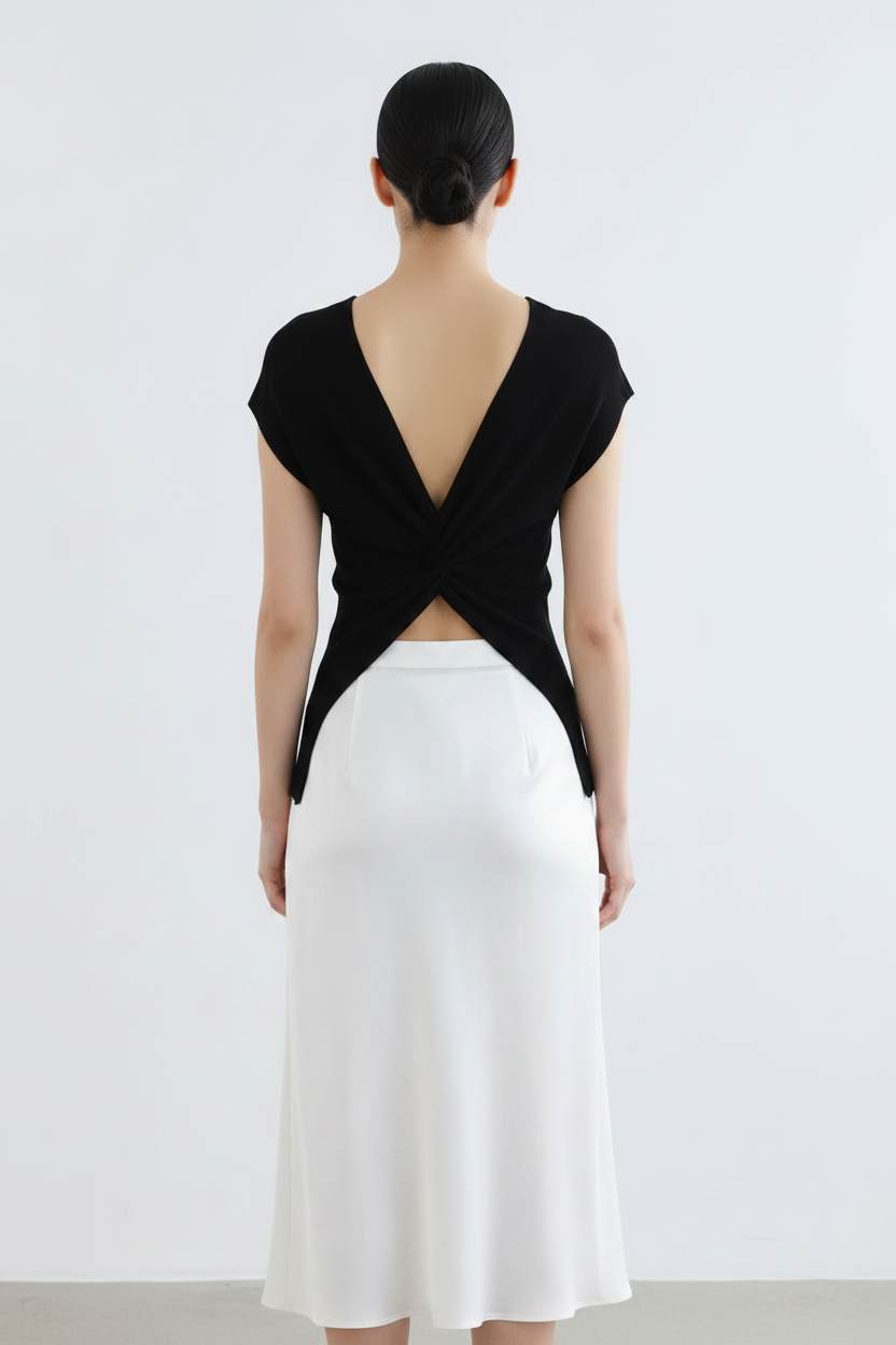 Back view – Black Twist Knot Top with White Satin Midi Skirt