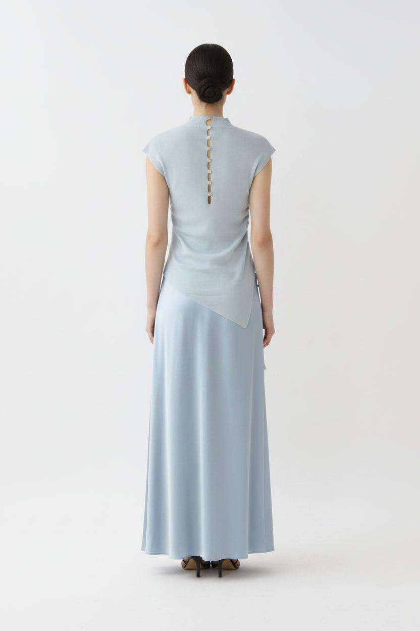 Back view – Blue Button-Back Knit Top with Satin Skirt