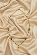 Earthy Mixed Seed Bead & Sunburst Pendant Necklace — Flat Lay