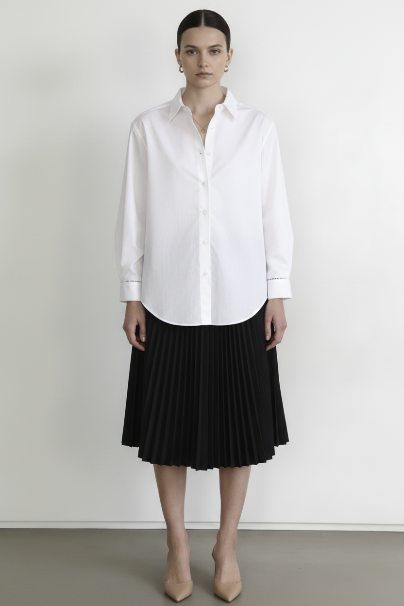 Front view – White Linen Shirt Untucked over Black Pleated Midi Skirt