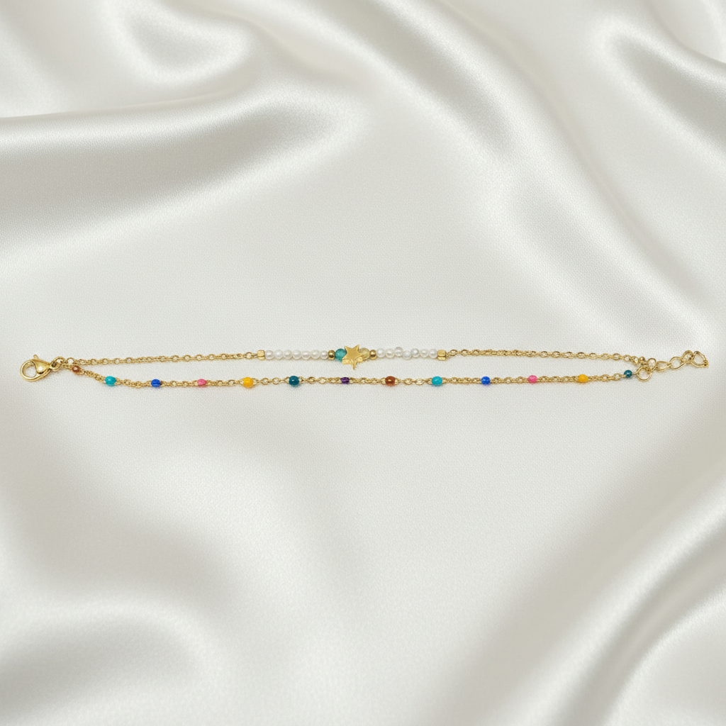 Gold Star Double-Layer Bracelet & Anklet flat lay on satin