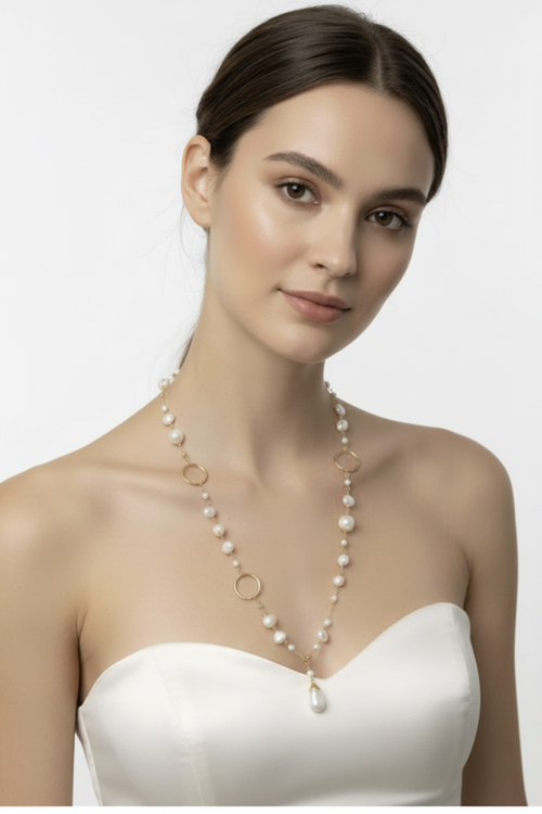 Model in Strapless Silk Dress with Pearl Necklace