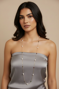 Real model with satin top and pearl necklace