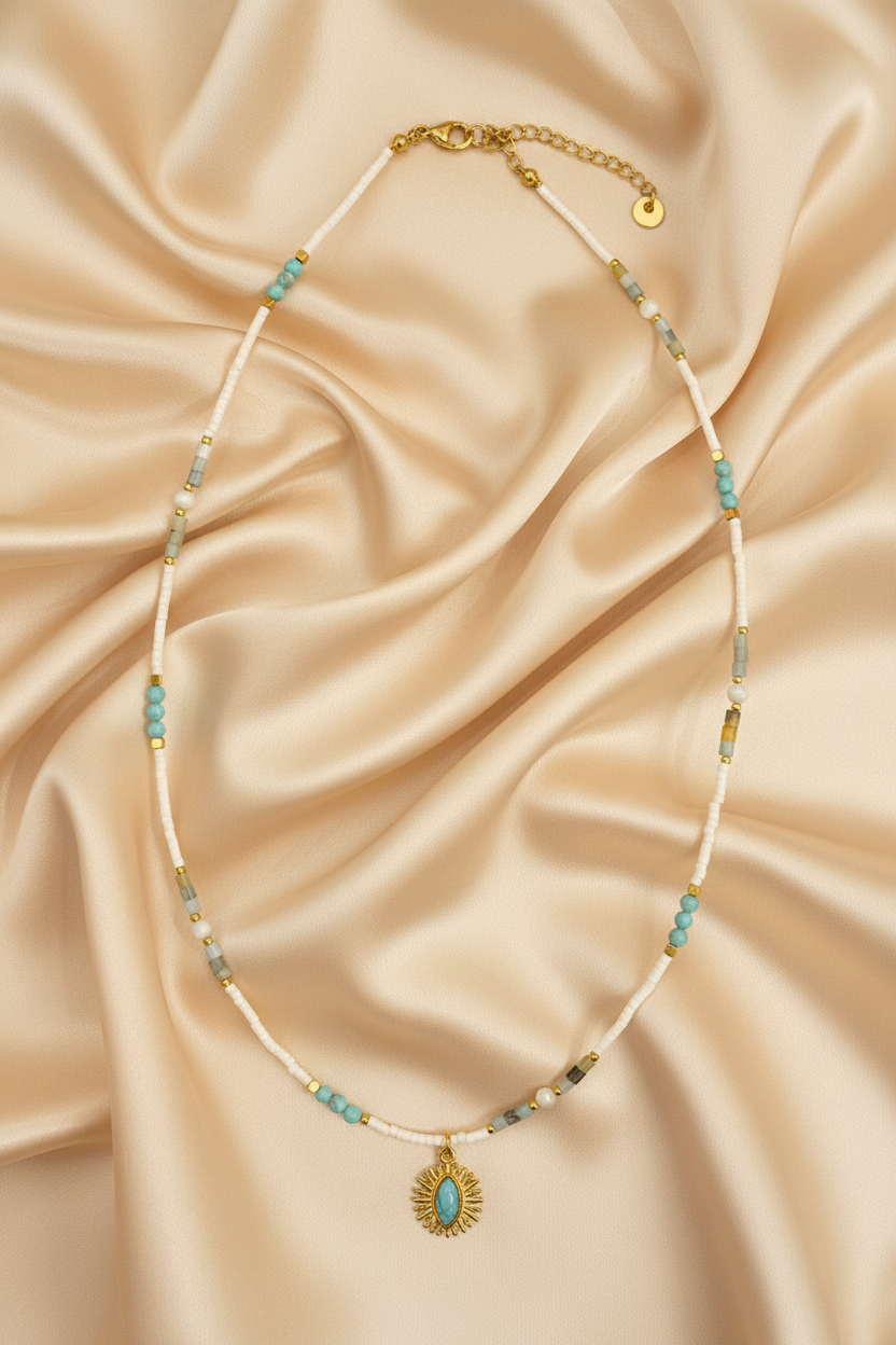 White Tube & Turquoise Sunburst Pendant Necklace — Flat Lay